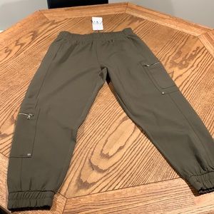 Army green trousers with zipper detail on both legs